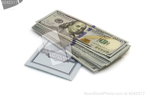 Image of One hundred dollars banknotes lie on checkbook isolated on white background