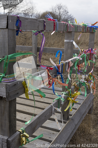 Image of Bridge desires railing tied with colored ribbons