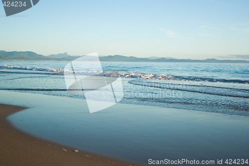 Image of gentle waves on the beach
