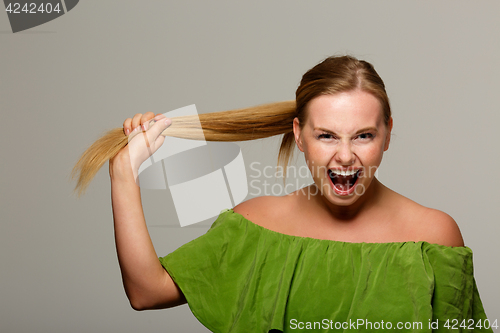 Image of Screaming model with bare shoulders