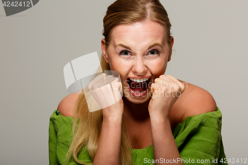 Image of Screaming woman in green dress