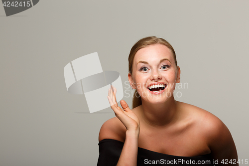 Image of Smiling model in black dress