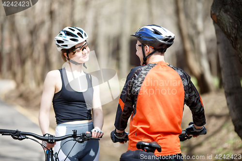 Image of Bicyclists in helmets at park