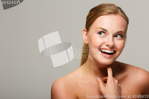Image of Young woman with bare shoulders