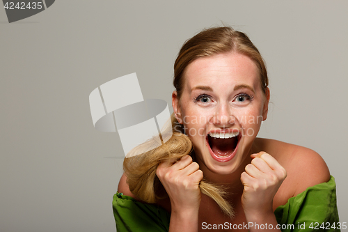 Image of Screaming woman with bare shoulders