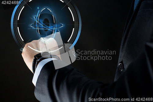 Image of close up of businessman hand with smartwatch