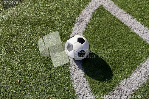 Image of soccer ball on football field