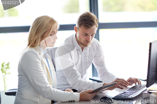 Image of business team with tablet pc computer at office