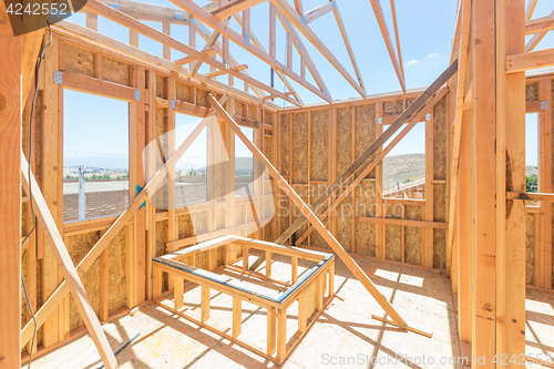 Image of Wood Home Framing Abstract At Construction Site.