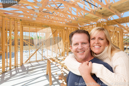 Image of Happy Excited Couple On Site Inside Their New Home Construction 