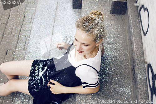 Image of young pretty party girl smiling covered with glitter tinsel, fashion dress, stylish make up, lifestyle people concept close up