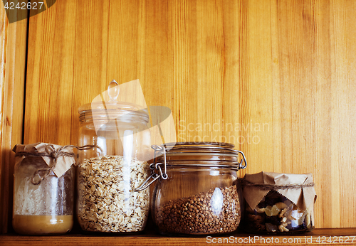 Image of real comfort wooden kitchen with breakfast ingredients close up 