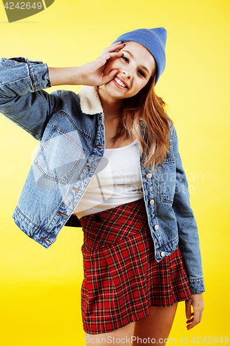 Image of lifestyle people concept: pretty young school teenage girl having fun happy smiling on yellow background closeup