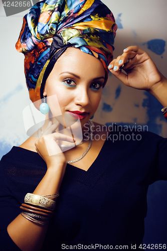 Image of beauty bright african woman with creative make up, shawl on head