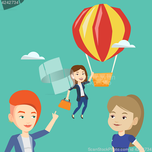 Image of Business woman hanging on balloon.