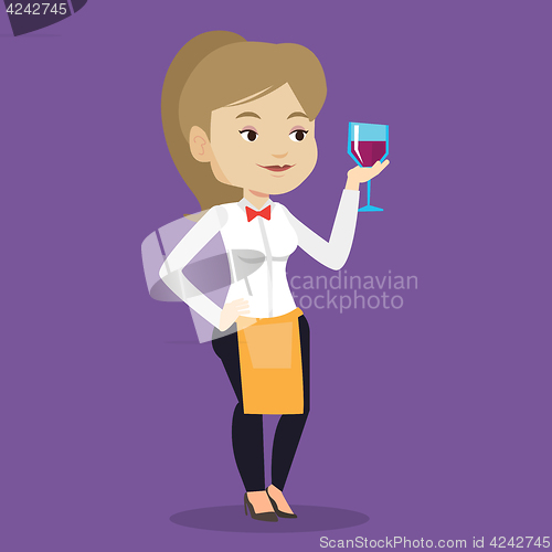 Image of Bartender holding a glass of wine in hand.