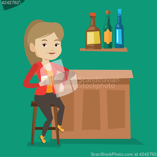 Image of Woman sitting at the bar counter.