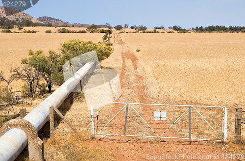 Image of pipe through farm