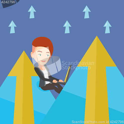 Image of Business woman working on laptop in the mountains.