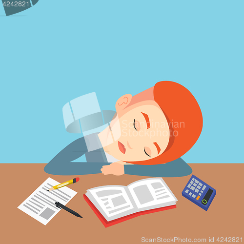 Image of Female student sleeping at the desk with book.