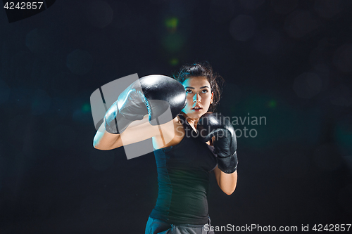 Image of The female boxer training at sport club