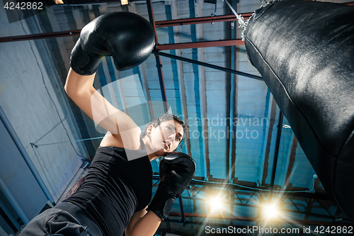 Image of The female boxer training at gym