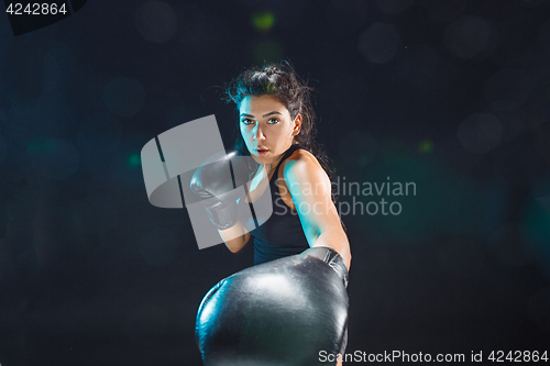 Image of The female boxer training at sport club