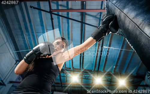 Image of The female boxer training at gym