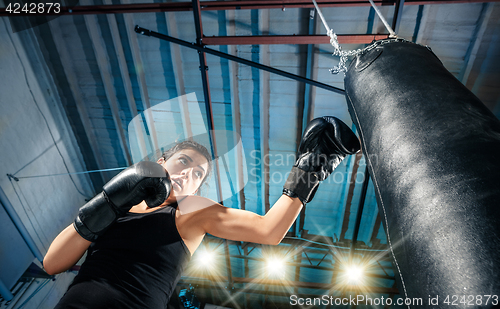 Image of The female boxer training at gym