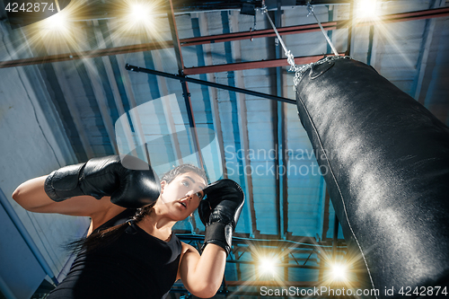 Image of The female boxer training at gym