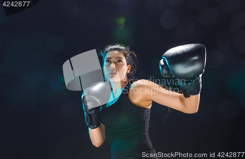 Image of The female boxer training at sport club