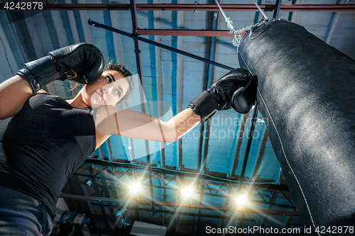 Image of The female boxer training at gym