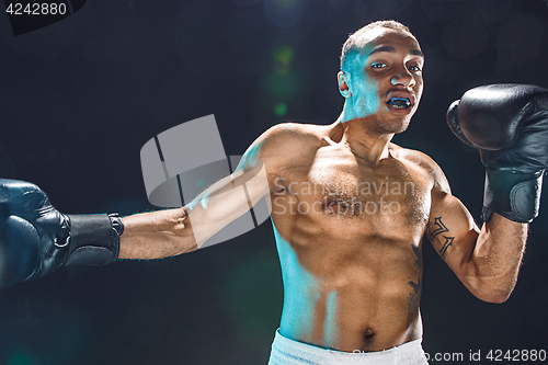 Image of Afro american male boxer.