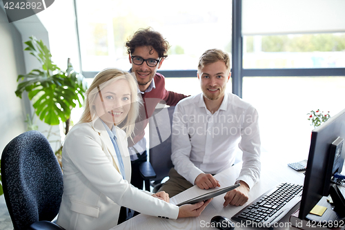 Image of business team with tablet pc at office