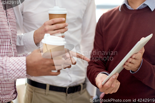 Image of business team with tablet pc and coffee at office