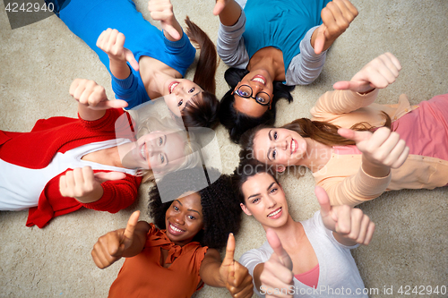 Image of international group of women showing thumbs up