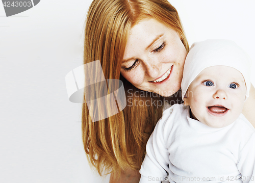 Image of young beauty mother with baby, red head happy family isolated cl