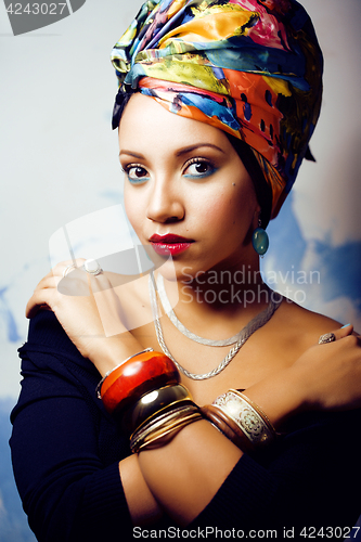 Image of beauty bright african woman with creative make up, shawl on head