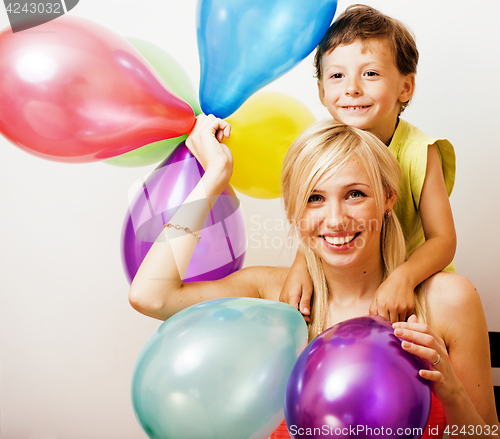 Image of pretty real family with color balloons on white background, blon