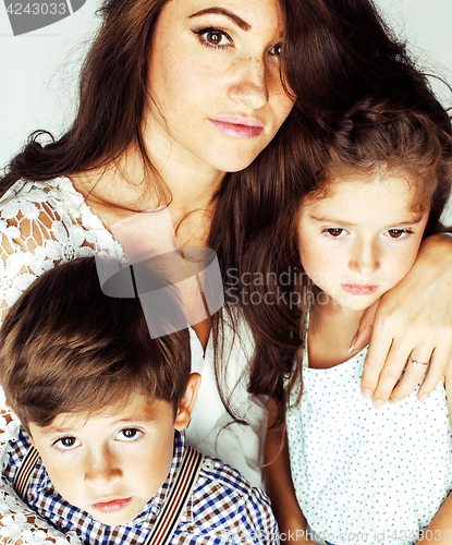 Image of young mother with two children on white, happy smiling family in