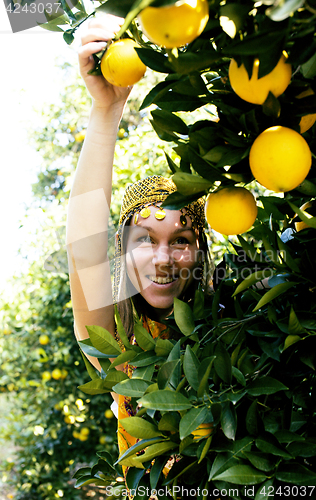 Image of pretty islam woman in orange grove smiling, real muslim girl che