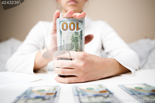 Image of Woman hands holding money