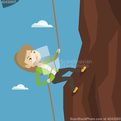 Image of Business woman climbing on the mountain.