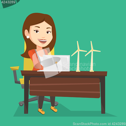 Image of Woman working with model of wind turbines.