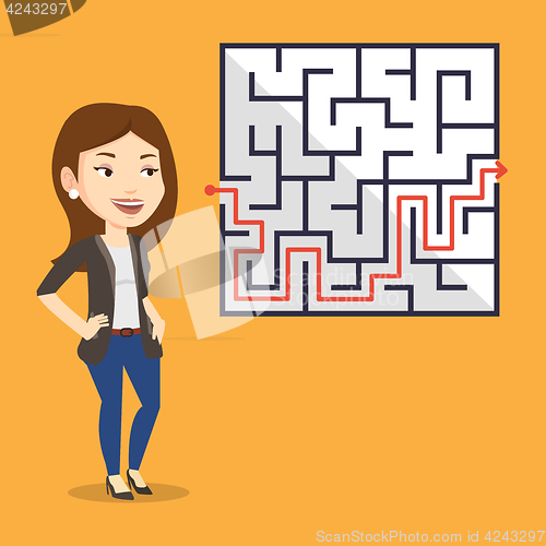 Image of Business woman looking at labyrinth with solution