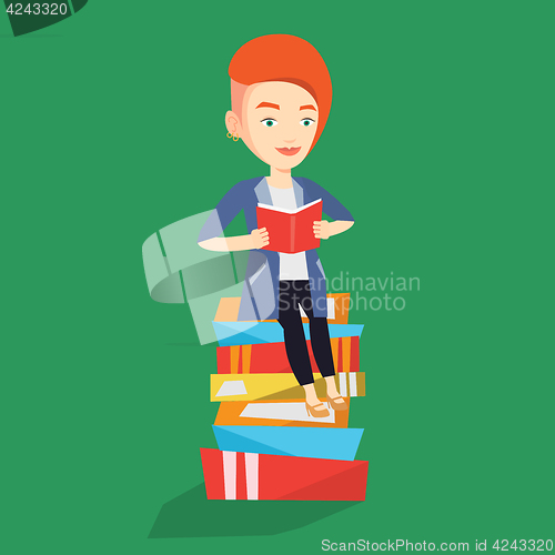 Image of Student sitting on huge pile of books.