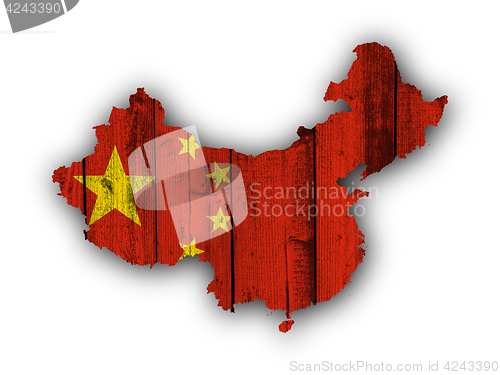 Image of Map and flag of China on weathered wood