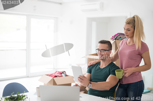 Image of Young couple moving in a new home