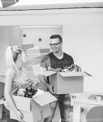 Image of young couple moving into a new home