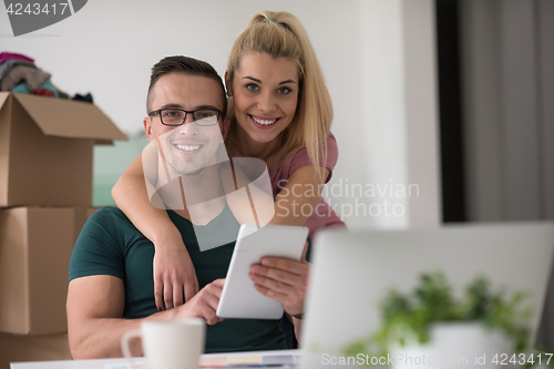 Image of Young couple moving in a new home